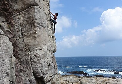 View of the pacific ocean while rock climbing at long dong taiwan 2 e1459874967144 Rock Climbing with Lydia Yang of LydiaEscapes