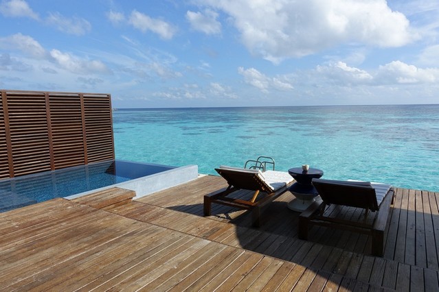 infinity pool and gorgeous deck chairs. Maldives Beach Paradise