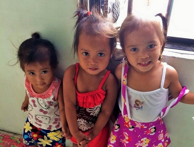 3 adorable children at the community day