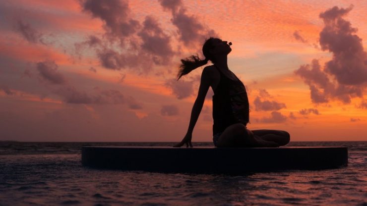 Yoga at Sunset. Breathe in and flow with the breeze at the Extreme Wow Suite
