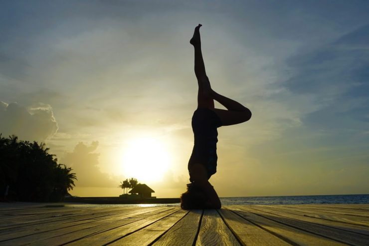 Sunset yoga poses in W Maldives