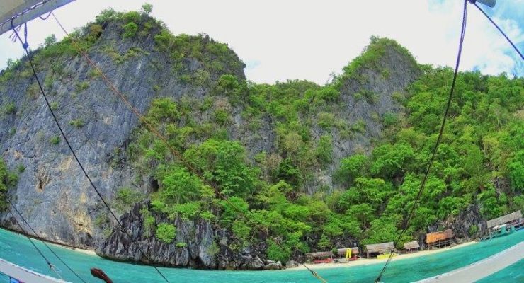 Breezing past stretches of cliffs of limestone rocks - underwater wrecks in coron and diving and snorkeling in palawan