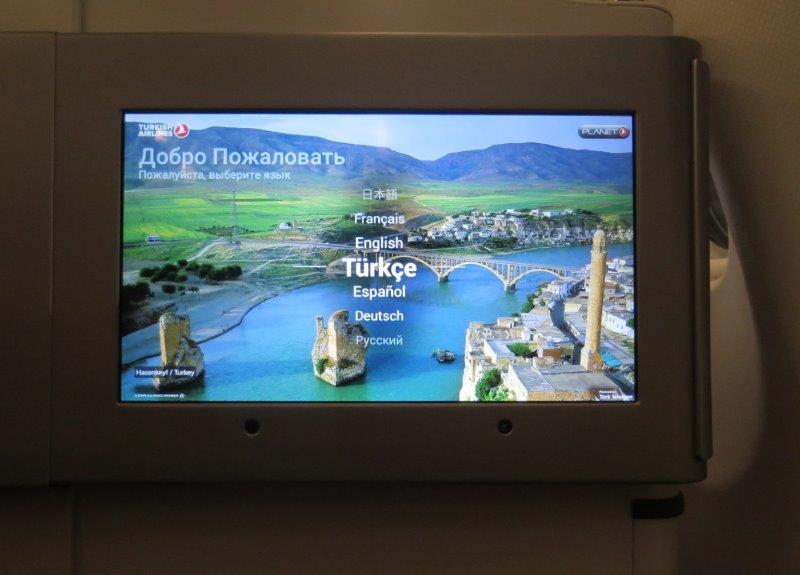 Welcome greetings on board the turkish airlines flight. Large screen to welcome us! Excited to start our black sea region adventure.