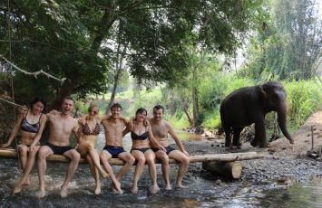 Group shot at river bed with elephant photo bombing! All smiles:D