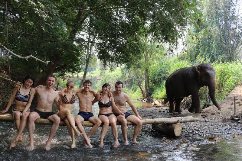Group shot at river bed with elephant photo bombing! All smiles:D