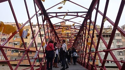 DSC06759 The famous red bridge of Girona, lined with yellow papers with poems