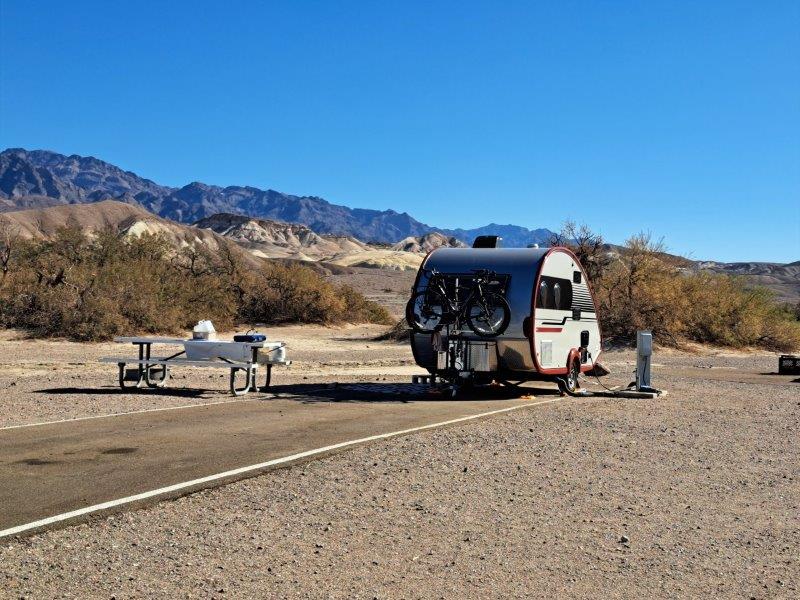 parked motorhome on desert spot with bicycles