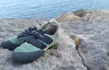 climbing shoes by the beach_og