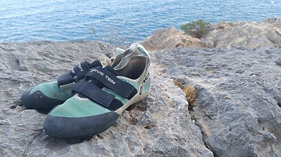 climbing shoes by the beach_og