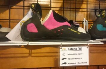 la sportiva pink climbing shoes on shelf