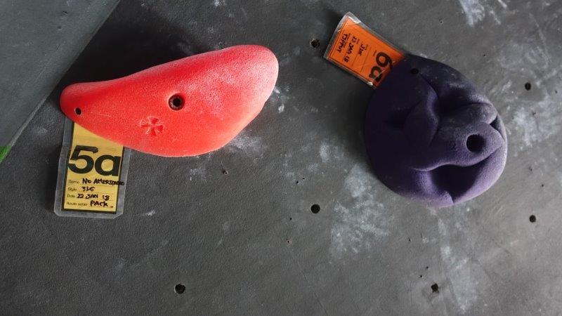 red climbing hold on gym wall_og