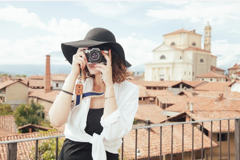 solo female travel taking a photo