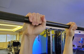 close up shot of pull up bar grip with both hands