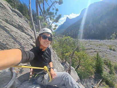 white helmet climber in sunglasses