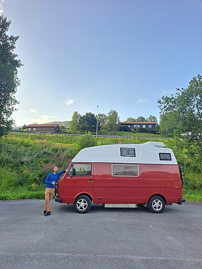 proud of our red RV og Top Money-Saving Tips for a Scandinavia Campervan Trip